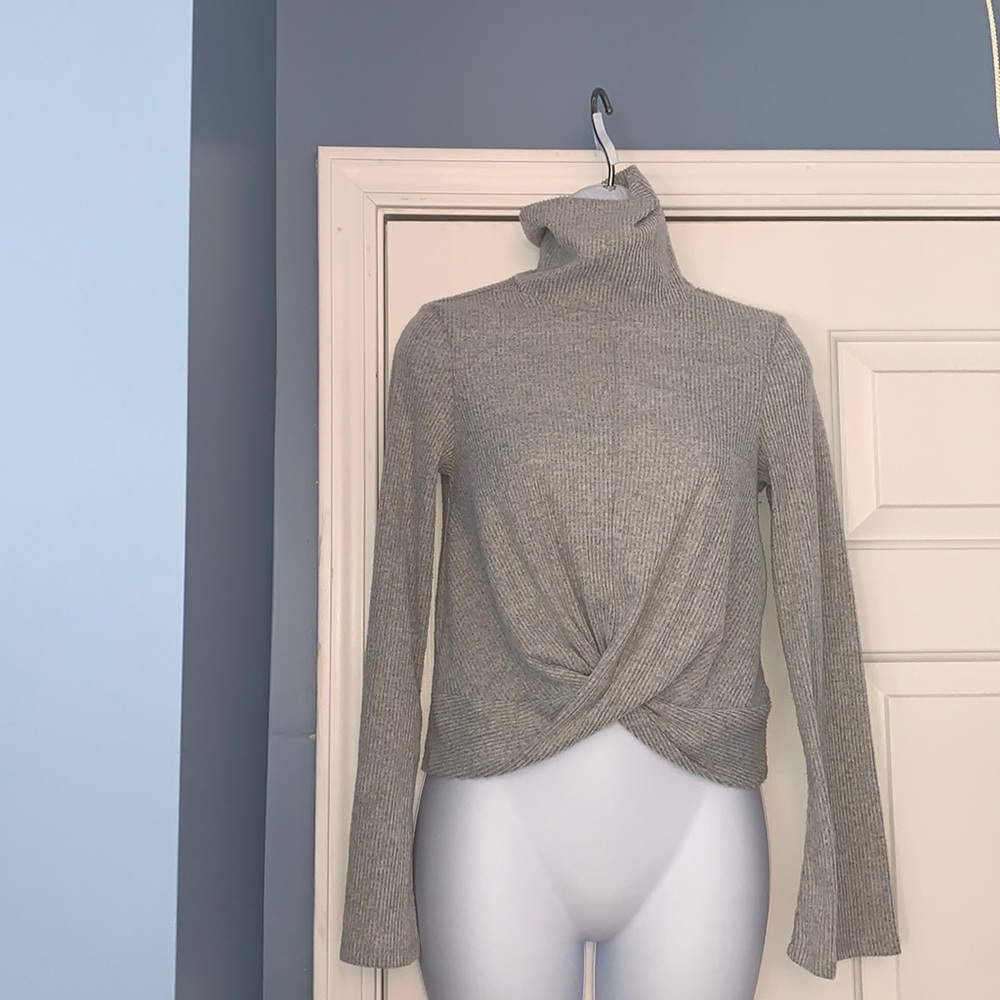 Soft gray turtleneck sweater crisscross waist detail